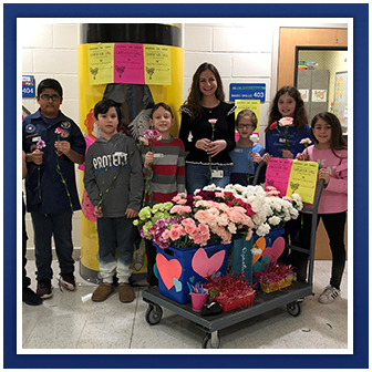 Students with flower cart