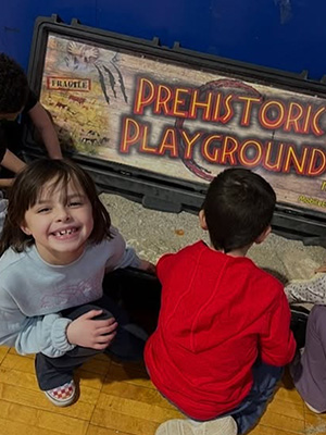 Students digging in a Prehistoric Playground