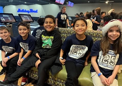 Students having fun during their bowling trip
