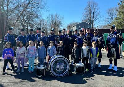 students with officers and their instruments