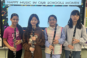 students holding clarinets