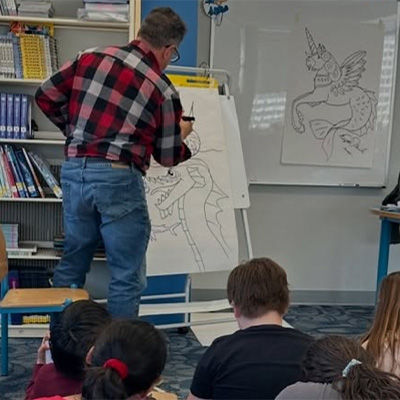 Author drawing a a dragon
