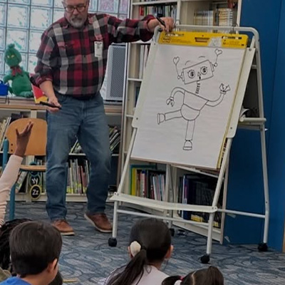 Author drawing a robot