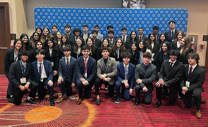 Forty-two students attending DECA competition