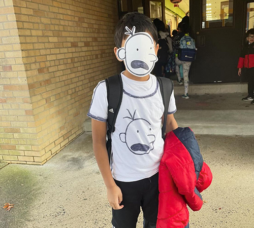 Student dressed up as a book character wearing a mask